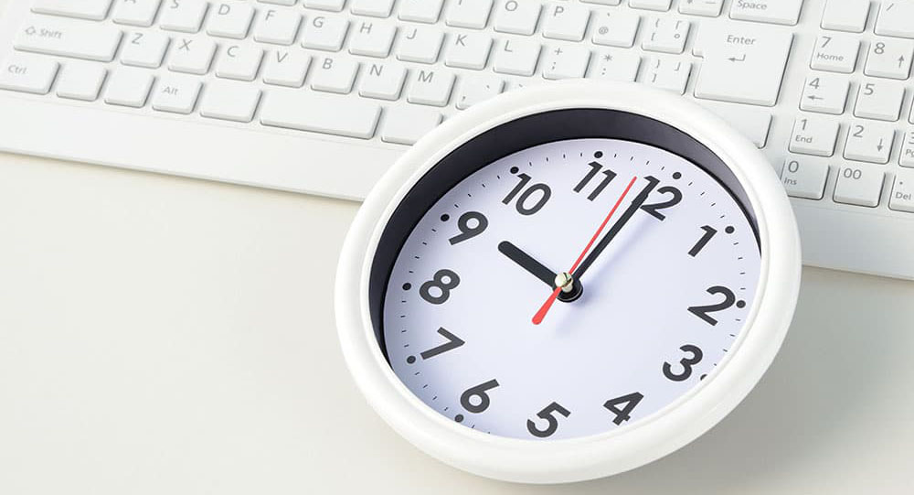 Image of a clock on a keyboard