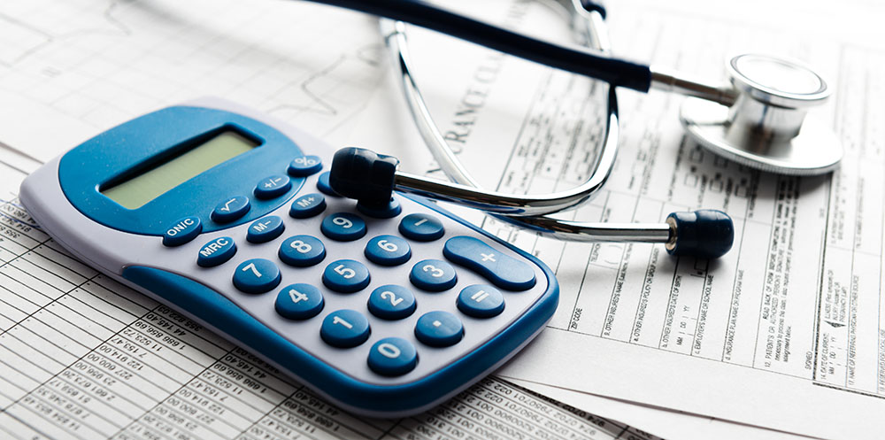 Image of a calculator and a generic medical bill